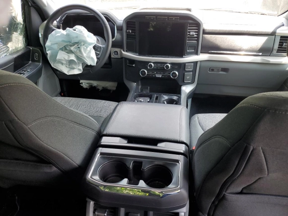 2023 Ford F-150 Lightning Pro z VIN 1FTVW1EL3PWG61686, wystawiony jako Copart lot #61353535 z przebiegiem 8 116 mil mil oraz Szkoda całkowita • Salvage title. Historia ofert i sprzedaży dostępna na DreamBid. Obrazek 8.