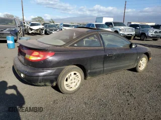 1999 Saturn SC with VIN 1G8ZR1274XZ262181, listed as a Copart auction lot 75931774 with Not Provided miles and Salvage Title. Bid and sale history available at carsss.com. Image 3.