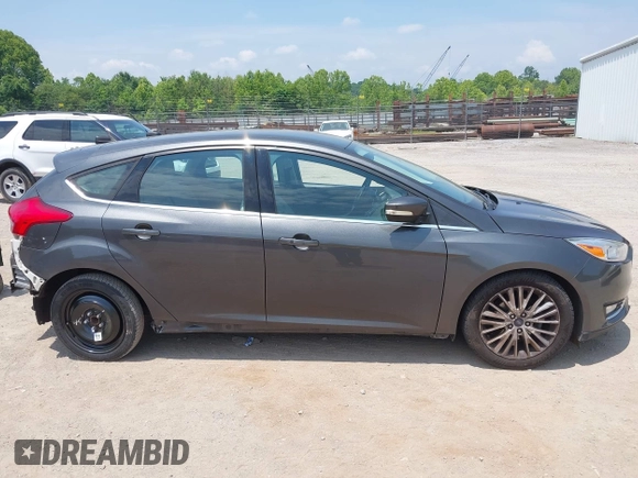 2016 Ford Focus Titanium with VIN 1FADP3N28GL299339, listed as a IAAI auction lot 42410154 with 78,245 mi miles and . Bid and sale history available at DreamBid. Image 13.