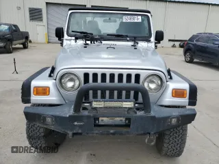 2005 Jeep Wrangler X with VIN 1J4FA39S55P353789, listed as a Copart auction lot 62469015 with 143,817 mi miles and Salvage title. Bid and sale history available at DreamBid. Image 5.