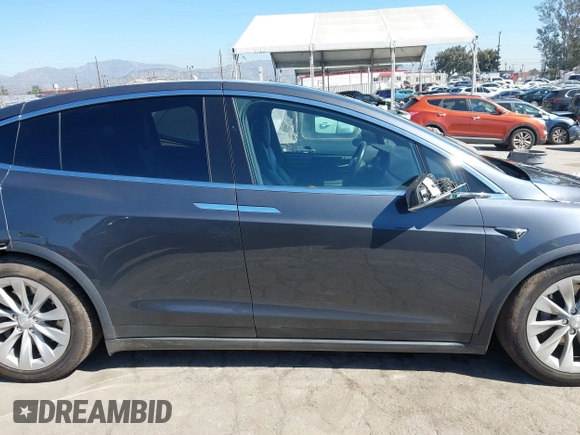 2018 Tesla Model X 75D with VIN 5YJXCBE26JF121937, listed as a IAAI auction lot 41652666 with 93,478 mi miles and . Bid and sale history available at carsss.com. Image 13.