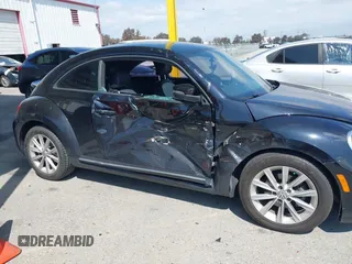 2017 Volkswagen Beetle 1.8T SE with VIN 3VWJ17ATXHM612411, listed as a IAAI auction lot 41900371 with 101,419 mi miles. Bid and sale history available at carsss.com. Image 6.