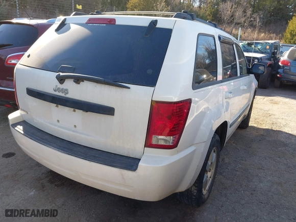 2009 Jeep Grand Cherokee Laredo with VIN 1J8GS48K29C518895, listed as a IAAI auction lot 41161045 with 153,499 mi miles. Bid and sale history available at carsss.com. Image 4.