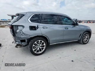 2024 BMW X5 xDrive40i with VIN 5UX23EU09R9T07066, listed as a Copart auction lot 61271495 with 18,042 mi miles and Salvage title. Bid and sale history available at DreamBid. Image 3.