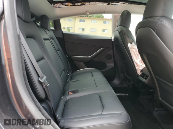 2024 Tesla Model Y with VIN 7SAYGDED2RF040079, listed as a Copart auction lot 57237054 with 2,549 mi miles and Non Repairable. Bid and sale history available at DreamBid. Image 10.