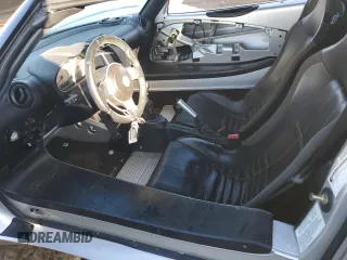 2006 Lotus Elise z VIN SCCPC11136HL31487, wystawiony jako Copart lot #79508394 z przebiegiem 27 575 mil mil oraz Szkody całkowita. Historia ofert i sprzedaży dostępna na DreamBid. Obrazek 7.