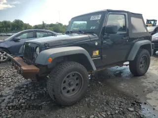 2011 Jeep Wrangler Sport z VIN 1J4GA2D16BL511735, wystawiony jako Copart lot #63292705 z przebiegiem 136 609 mil mil oraz Szkoda całkowita • Salvage title. Historia ofert i sprzedaży dostępna na DreamBid. Obrazek 1.