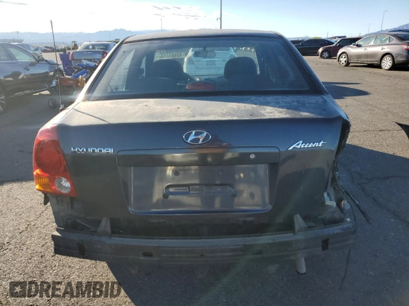 2005 Hyundai Accent GLS with VIN KMHCG45C95U665574, listed as a Copart auction lot 82603804 with 154,187 mi miles and Salvage Title. Bid and sale history available at carsss.com. Image 6.