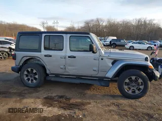 2018 Jeep Wrangler Unlimited Sahara z VIN 1C4HJXEN4JW173435, wystawiony jako IAAI lot #41453040 z przebiegiem 51 530 mil mil oraz . Historia ofert i sprzedaży dostępna na DreamBid. Obrazek 13.