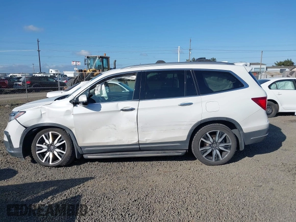 2021 Honda Pilot Touring 8-Passenger with VIN 5FNYF6H92MB031782, listed as a IAAI auction lot 42087322 with 70,062 mi miles and . Bid and sale history available at DreamBid. Image 14.