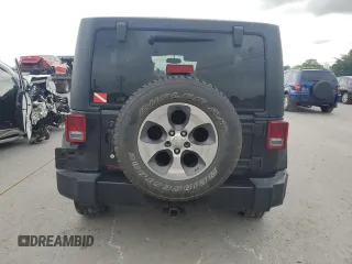 2017 Jeep Wrangler Unlimited Sahara with VIN 1C4BJWEG9HL633296, listed as a Copart auction lot 61387685 with 74,035 mi miles and Salvage title. Bid and sale history available at DreamBid. Image 6.