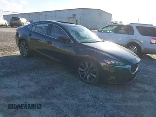 2018 Mazda Mazda6 Touring with VIN JM1GL1VM4J1307304, listed as a IAAI auction lot 41556563 with 173,739 mi miles. Bid and sale history available at carsss.com. Image 1.