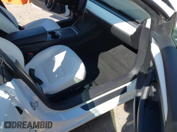 2022 Tesla Model 3 with VIN 5YJ3E1EA7NF103513, listed as a IAAI auction lot 41643592 with 35,631 mi miles and . Bid and sale history available at DreamBid. Image 5.