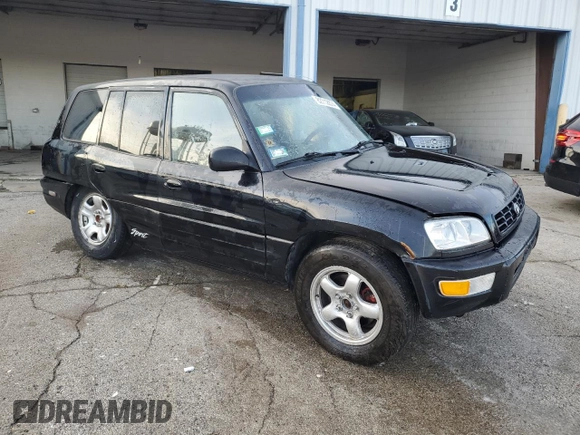 1999 Toyota RAV4 with VIN JT3GP10V9X7042801, listed as a Copart auction lot 82712874 with 256,151 mi miles and Salvage Title. Bid and sale history available at DreamBid. Image 4.