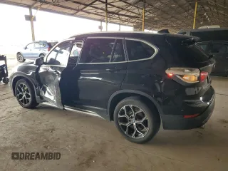 2021 BMW X1 sDrive28i z VIN WBXJG7C02M5S30154, wystawiony jako Copart lot #56076565 z przebiegiem 57 671 mil mil oraz Tytuł czysty. Historia ofert i sprzedaży dostępna na DreamBid. Obrazek 2.