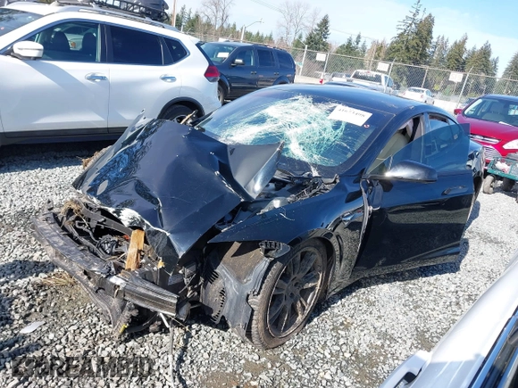 2021 Tesla Model S Long Range Plus z VIN 5YJSA1E24MF426299, wystawiony jako IAAI lot #41673498 z przebiegiem 102 035 mil mil oraz . Historia ofert i sprzedaży dostępna na DreamBid. Obrazek 14.