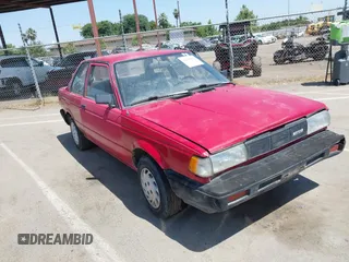 1990 Nissan Sentra z VIN JN1GB22B9LU001537, wystawiony jako IAAI lot #42440806 z przebiegiem 142 000 mil mil oraz . Historia ofert i sprzedaży dostępna na DreamBid. Obrazek 1.