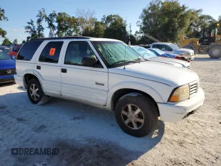 1999 Oldsmobile Bravada z VIN 1GHDT13W1X2704151, wystawiony jako Copart lot #76802764 z przebiegiem 155 630 mil mil oraz Szkody całkowita. Historia ofert i sprzedaży dostępna na DreamBid. Obrazek 4.