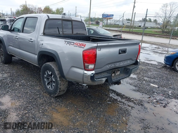 2016 Toyota Tacoma SR with VIN 5TFCZ5AN5GX026458, listed as a IAAI auction lot 41975246 with 208,401 mi miles and . Bid and sale history available at DreamBid. Image 3.