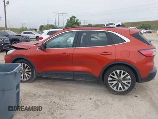 2020 Ford Escape Titanium Hybrid with VIN 1FMCU0DZ1LUB13684, listed as a IAAI auction lot 41629782 with 31,669 mi miles and . Bid and sale history available at DreamBid. Image 14.