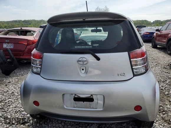 2012 Scion iQ with VIN JTNJJXB03CJ015321, listed as a Copart auction lot 54332355 with 63,439 mi miles and Salvage title. Bid and sale history available at DreamBid. Image 6.