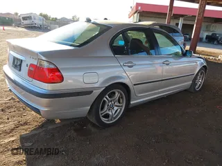 2005 BMW 3 Series 330i with VIN WBAEV53475KM43130, listed as a IAAI auction lot 41361364 with 152,382 mi miles. Bid and sale history available at carsss.com. Image 4.