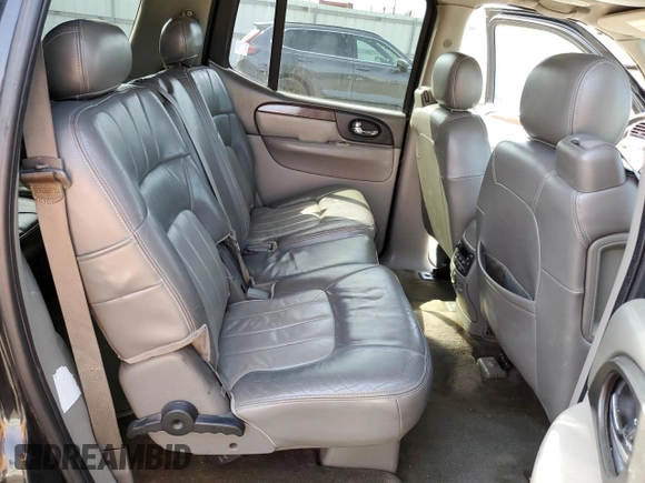 2003 GMC Envoy SLT z VIN 1GKET16PX36243554, wystawiony jako Copart lot #49083975 z przebiegiem 148 596 mil mil oraz Szkoda całkowita • Salvage title. Historia ofert i sprzedaży dostępna na DreamBid. Obrazek 12.