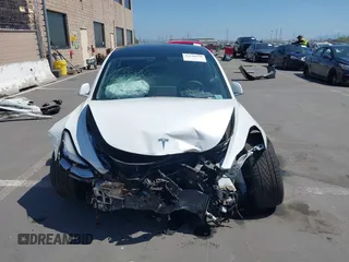 2020 Tesla Model 3 Standard Range Plus with VIN 5YJ3E1EAXLF590591, listed as a IAAI auction lot 42140338 with 79,342 mi miles and . Bid and sale history available at DreamBid. Image 13.