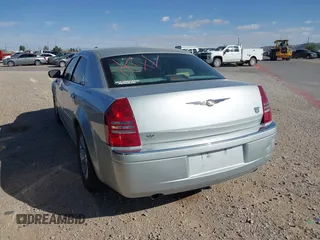 2006 Chrysler 300 C with VIN 2C3KA63H46H154990, listed as a IAAI auction lot 42004790 with 233,673 mi miles. Bid and sale history available at carsss.com. Image 3.