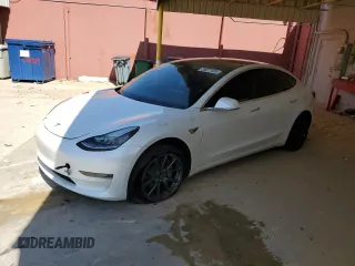 2020 Tesla Model 3 Long Range z VIN 5YJ3E1EBXLF665802, wystawiony jako Copart lot #54877435 z przebiegiem 36 697 mil mil oraz Szkoda całkowita • Salvage title. Historia ofert i sprzedaży dostępna na DreamBid. Obrazek 1.