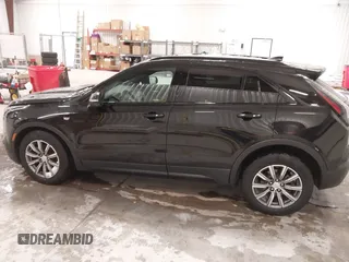 2020 Cadillac XT4 AWD Sport with VIN 1GYFZFR43LF090264, listed as a IAAI auction lot 41261586 with 65,859 mi miles and . Bid and sale history available at DreamBid. Image 14.