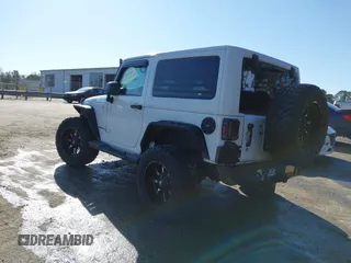 2014 Jeep Wrangler Sport with VIN 1C4AJWAG0EL245337, listed as a IAAI auction lot 41532314 with 140,721 mi miles and . Bid and sale history available at DreamBid. Image 3.