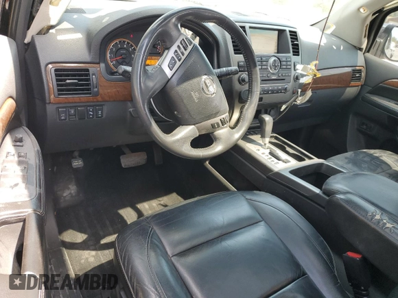 2014 Nissan Armada Platinum z VIN 5N1BA0NF8EN610981, wystawiony jako Copart lot #53144515 z przebiegiem 188 423 mil mil oraz Szkoda całkowita • Salvage title. Historia ofert i sprzedaży dostępna na DreamBid. Obrazek 8.