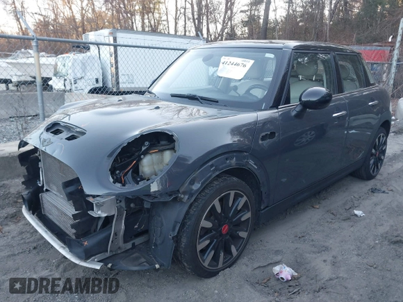 2016 MINI Cooper Hardtop 4 Door S with VIN WMWXU3C56G2B63682, listed as a IAAI auction lot 41244676 with 110,902 mi miles. Bid and sale history available at carsss.com. Image 18.