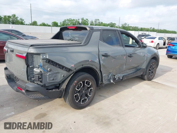2022 Hyundai Santa Cruz SEL with VIN 5NTJBDAE4NH022823, listed as a IAAI auction lot 42051616 with 23,158 mi miles and . Bid and sale history available at DreamBid. Image 4.