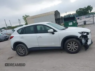 2016 Mazda CX-5 Sport with VIN JM3KE2BY1G0875484, listed as a IAAI auction lot 41838122 with 166,986 mi miles. Bid and sale history available at carsss.com. Image 13.