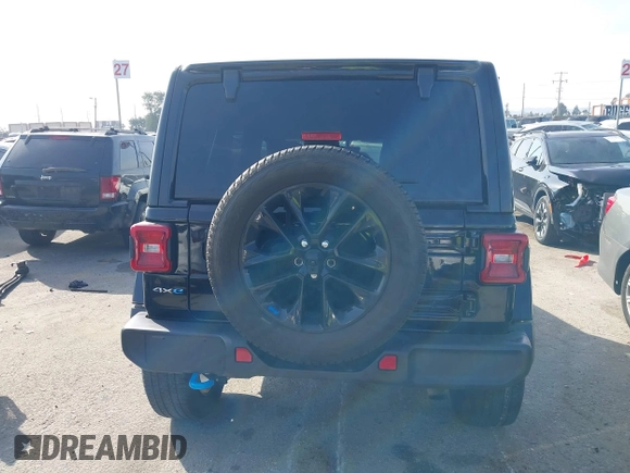 2023 Jeep Wrangler Sahara with VIN 1C4JJXP67PW556933, listed as a IAAI auction lot 41587035 with 20,463 mi miles and . Bid and sale history available at DreamBid. Image 16.