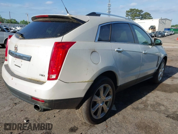 2014 Cadillac SRX Performance Collection with VIN 3GYFNCE36ES662689, listed as a IAAI auction lot 42109417 with 132,957 mi miles. Bid and sale history available at carsss.com. Image 4.