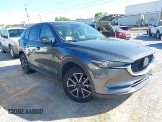 2018 Mazda CX-5 Grand Touring with VIN JM3KFBDM7J0454836, listed as a IAAI auction lot 42001397 with 146,879 mi miles. Bid and sale history available at carsss.com. Image 1.