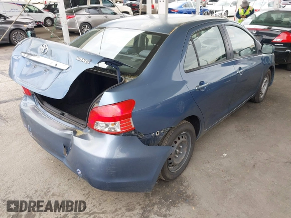 2009 Toyota Yaris with VIN JTDBT903791302911, listed as a IAAI auction lot 42181264 with 183,321 mi miles. Bid and sale history available at carsss.com. Image 4.