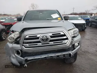 2018 Toyota Tacoma SR with VIN 5TFGZ5AN4JX142565, listed as a IAAI auction lot 41353718 with 87,544 mi miles and . Bid and sale history available at carsss.com. Image 12.