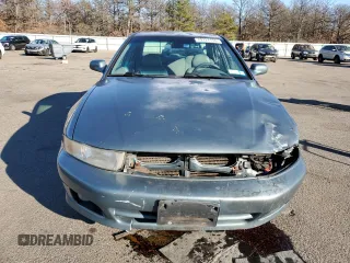 2000 Mitsubishi Galant LS with VIN 4A3AA56LXYE174881, listed as a Copart auction lot 79727154 with 106,001 mi miles and Salvage Title. Bid and sale history available at carsss.com. Image 5.