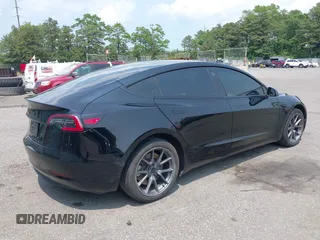 2023 Tesla Model 3 z VIN 5YJ3E1EA4PF565899, wystawiony jako IAAI lot #42436473 z przebiegiem 30 141 mil mil oraz . Historia ofert i sprzedaży dostępna na DreamBid. Obrazek 4.