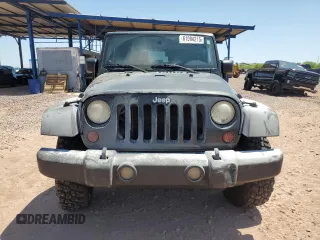 2009 Jeep Wrangler Rubicon with VIN 1J4GA64179L703716, listed as a Copart auction lot 61084215 with 190,262 mi miles and Salvage title. Bid and sale history available at DreamBid. Image 5.