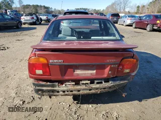 2001 Suzuki Esteem GL z VIN JS2GB41S915202412, wystawiony jako Copart lot #88372235 z przebiegiem 301 061 mil mil oraz Szkoda całkowita • Salvage title. Historia ofert i sprzedaży dostępna na DreamBid. Obrazek 6.