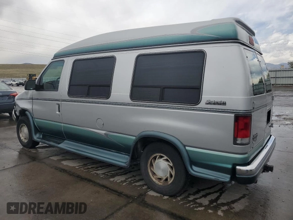 1999 Ford Econoline Cargo Recreational with VIN 1FDRE14L3XHA31771, listed as a Copart auction lot 49973795 with 220,268 mi miles and Salvage title. Bid and sale history available at DreamBid. Image 2.