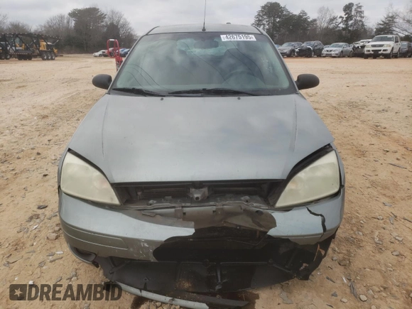 2006 Ford Focus S with VIN 1FAHP37N76W180039, listed as a Copart auction lot 58328565 with 220,696 mi miles and Salvage title. Bid and sale history available at DreamBid. Image 5.