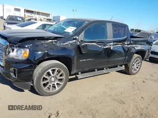 2021 GMC Canyon 4WD Denali z VIN 1GTG6EEN9M1240596, wystawiony jako IAAI lot #40760124 z przebiegiem 52 985 mil mil oraz . Historia ofert i sprzedaży dostępna na DreamBid. Obrazek 21.