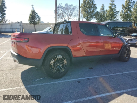 2023 Rivian R1T Adventure z VIN 7FCTGAAA0PN024599, wystawiony jako Copart lot #50269955 z przebiegiem Nie podano mil oraz Szkody całkowita. Historia ofert i sprzedaży dostępna na DreamBid. Obrazek 3.