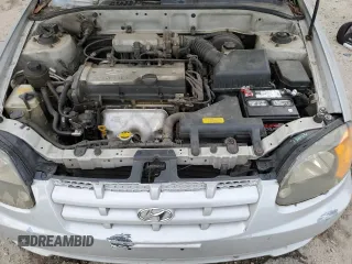 2003 Hyundai Accent GL with VIN KMHCG35CX3U270374, listed as a Copart auction lot 47240325 with 122,739 mi miles and Salvage Title. Bid and sale history available at carsss.com. Image 11.